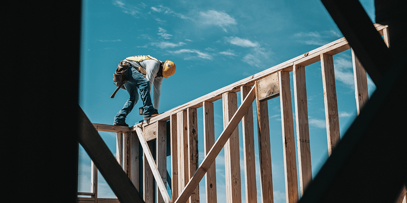 construction worker on wood beam project