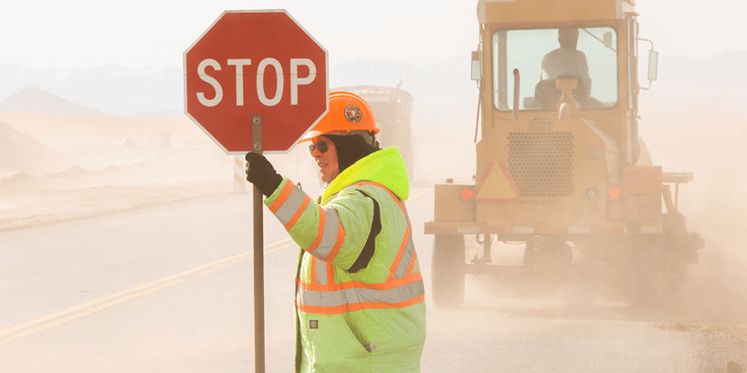 roadside worker with stop sign